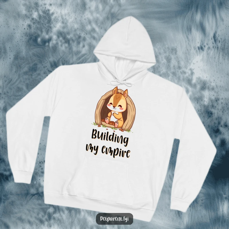 Funny and focused scene of a squirrel character building its den, featured on a soft, hooded sweatshirt.