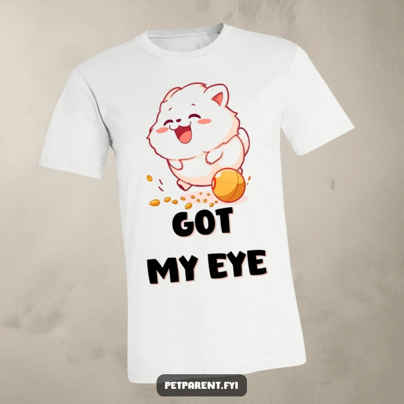 Funny t-shirt: a fluffy creature gleefully pursuing a rolling food pellet with energetic excitement and delight.