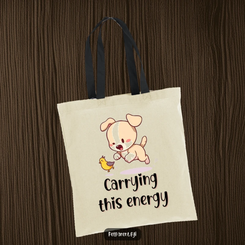 Funny tote bag with a playful puppy character chasing a tumbling baby bird, perfect for carrying items with joy.